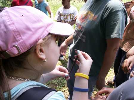 Student handing snake